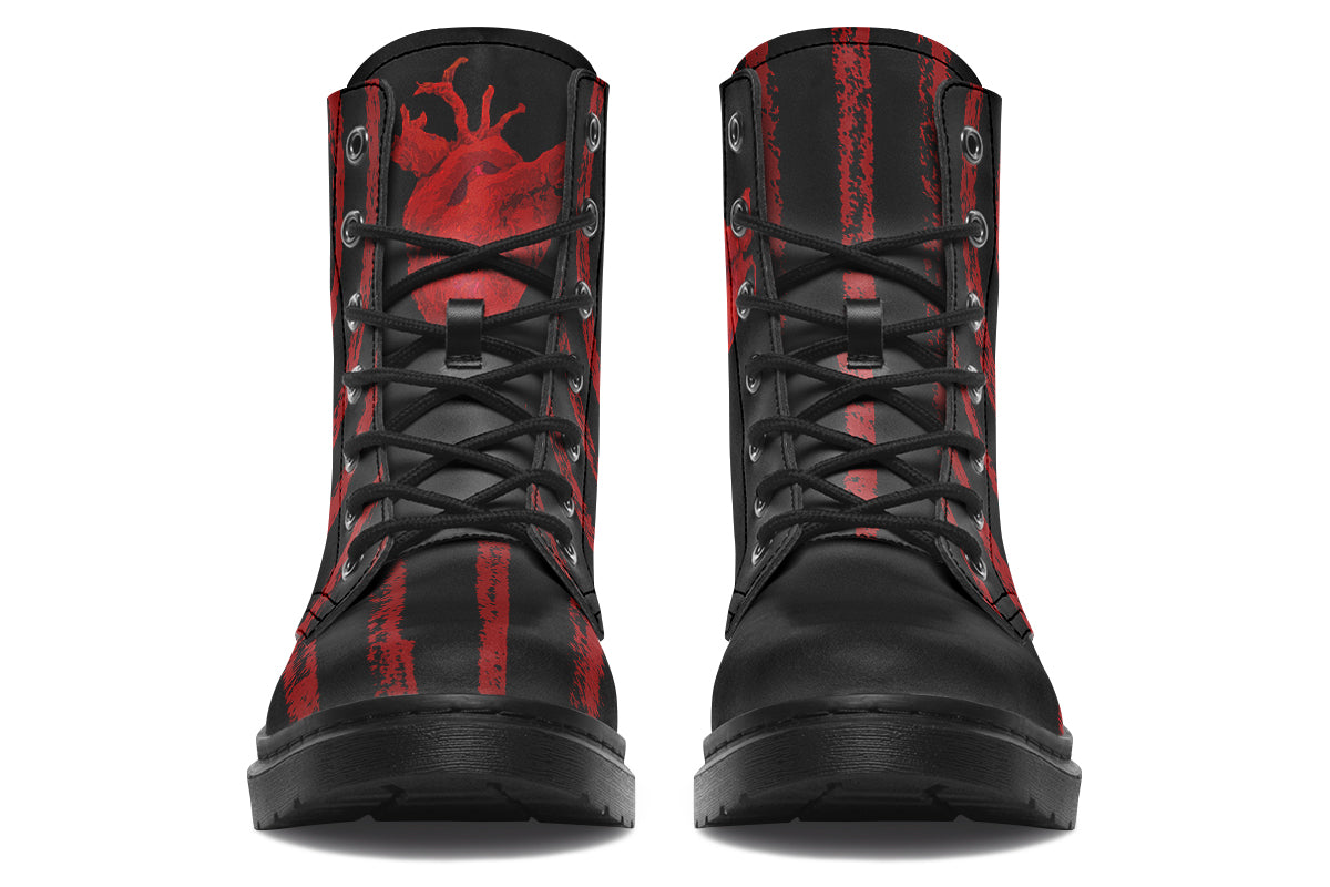 Goth combat boots with red anatomical heart artwork