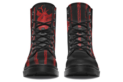 Goth combat boots with red anatomical heart artwork