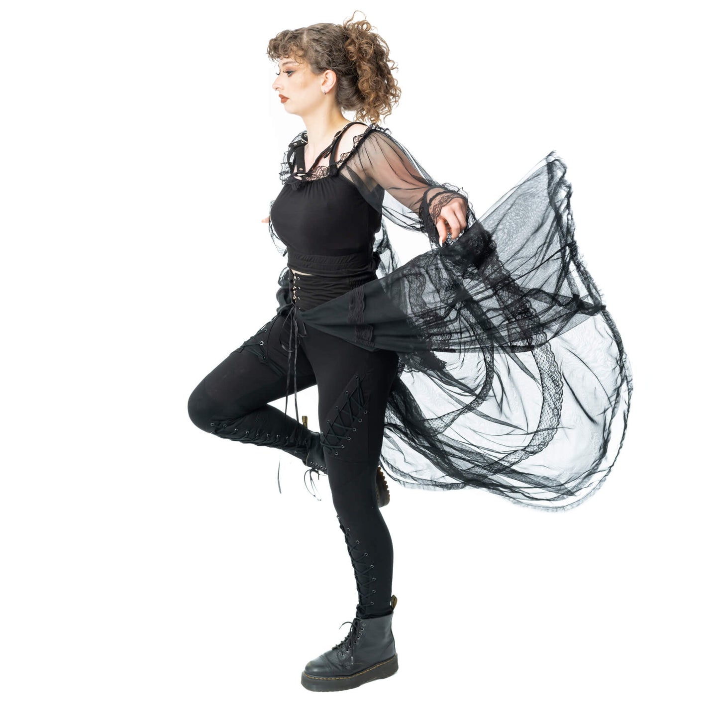 Model showcasing Poizen Industries Eliora Skirt Black, featuring sheer panels and lace details, perfect for gothic fashion.