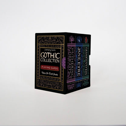 The Literary Suits Gothic Collection boxed set: a black box holding three slim deck boxes side by side, their coloured spines showing.