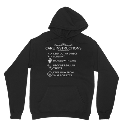 Black hoodie with white “Care Instructions” humour print