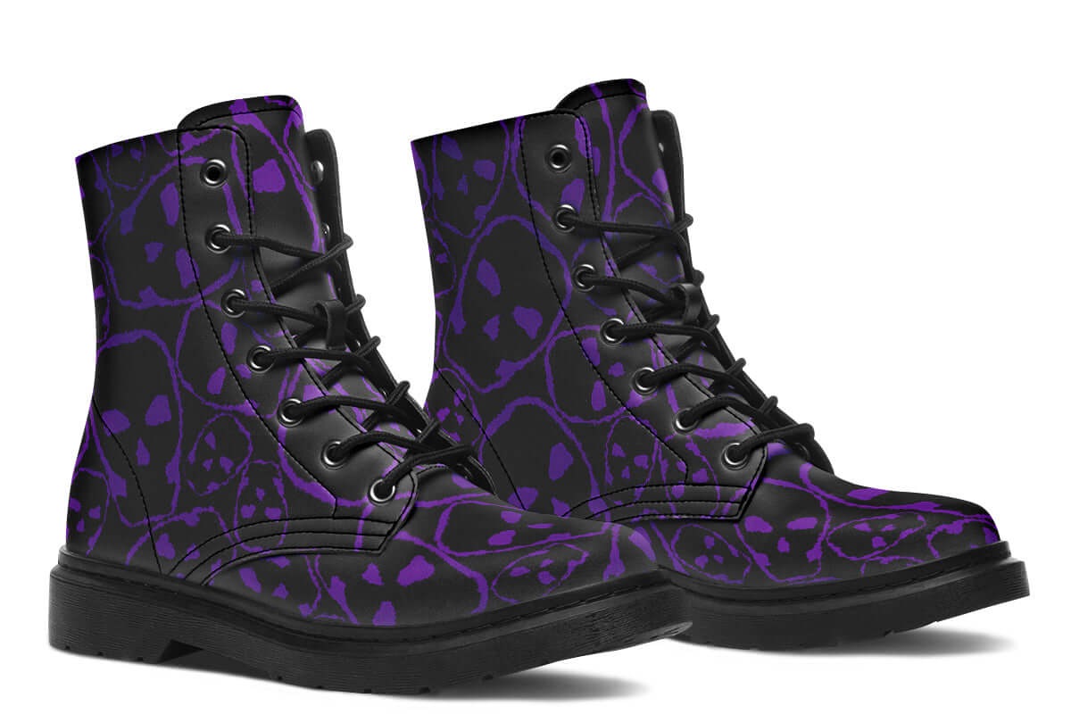 Black high-top boots with purple skull pattern on a white background