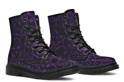 Black high-top boots with purple skull pattern on a white background