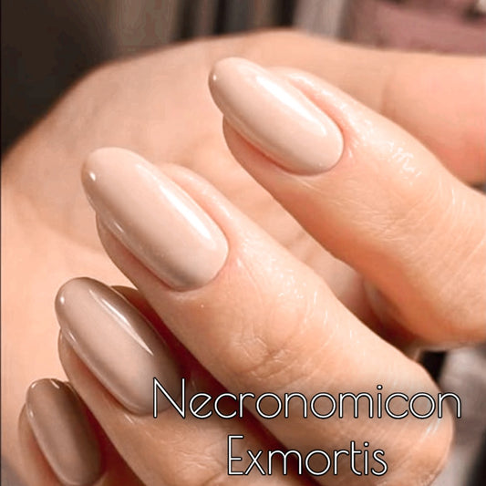 Close-up of taupe nude gloss nail polish on fingers, showcasing smooth finish of Radioactive Unicorn Necronomicon Ex Mortis.