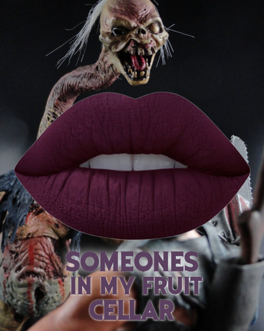 Gothic Lipstick in rich berry shade 'Someone's In My Fruit Cellar' against a darkly themed background.