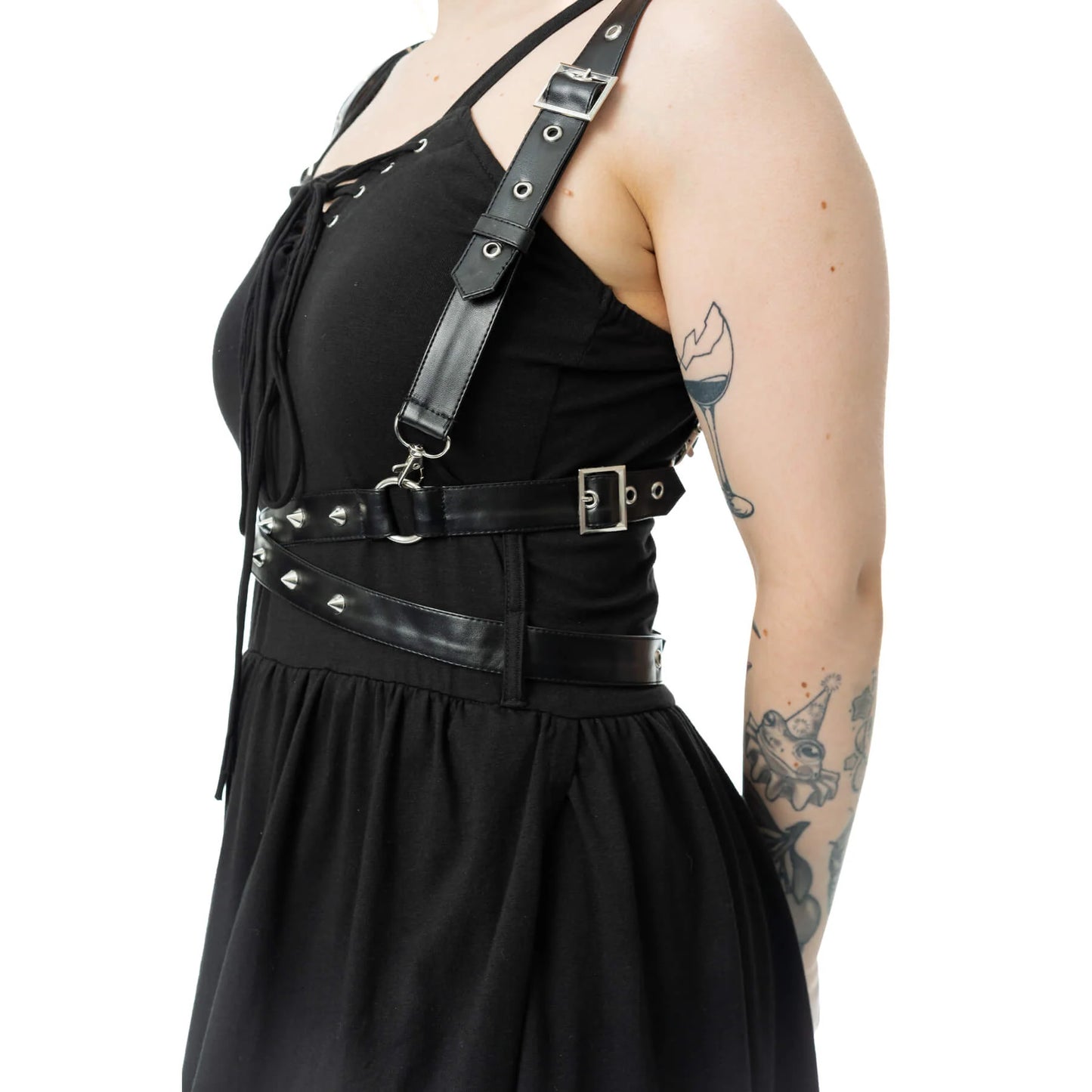 Side view of model wearing the Vixxsin Junia Maxi Dress Black with stylish harness details and gothic aesthetic.