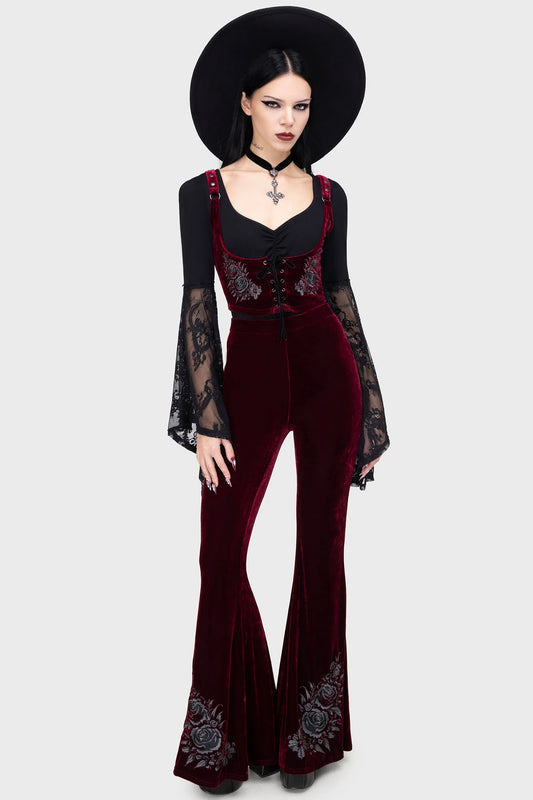 Front view of Killstar A Devil’s Rose flared trousers in deep red velvet with gothic embroidered roses
