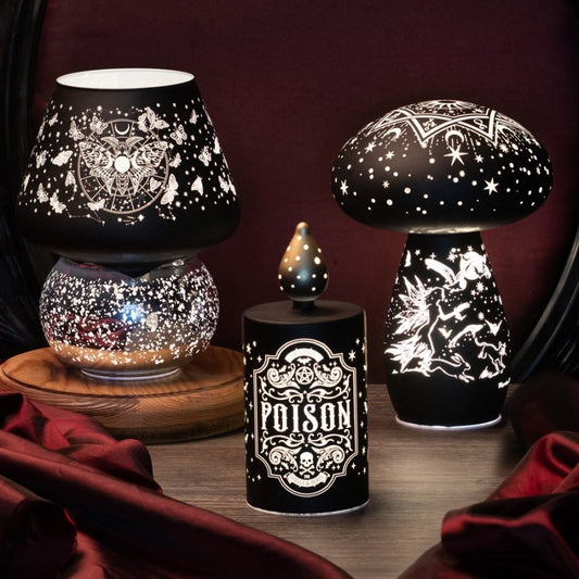Decorative lamps with intricate designs on a dark background