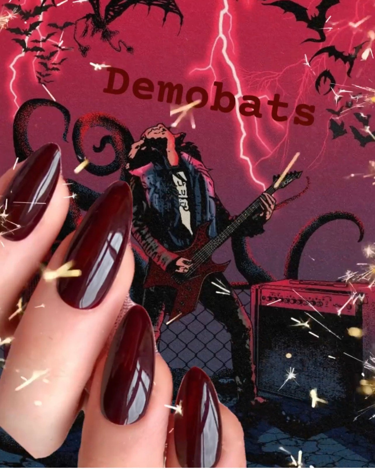 Radioactive Unicorn Demobats burgundy nail polish worn on nails with glossy shine and gothic inspired style