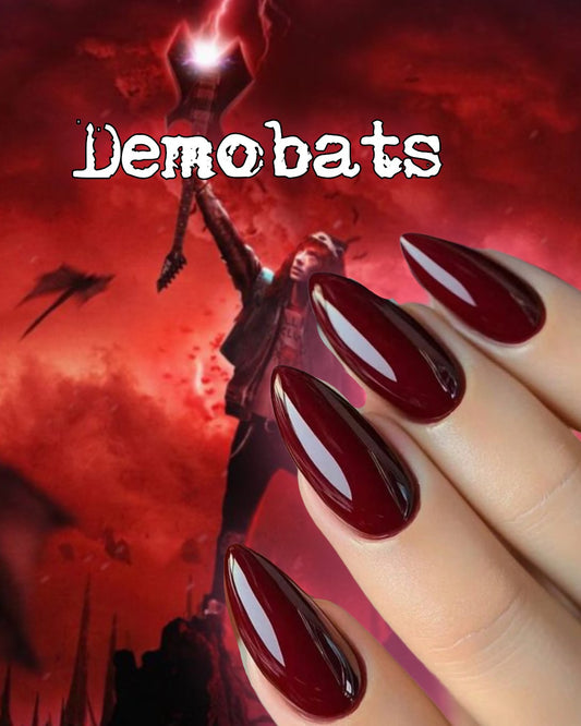 Radioactive Unicorn Demobats nail polish burgundy dark red glossy manicure with dramatic gothic shine