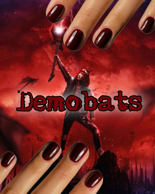 Radioactive Unicorn Demobats nail polish deep burgundy glossy finish on long nails with rich dark red colour