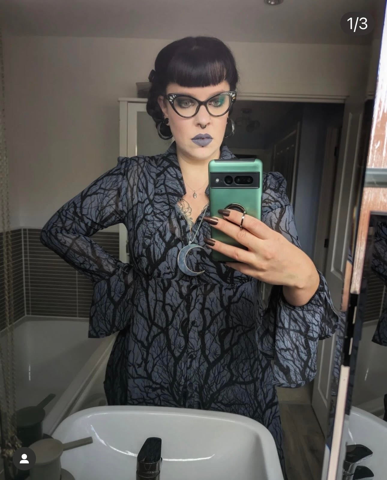 Radioactive Unicorn She's Alive lipstick lavender grey shade styled with gothic outfit