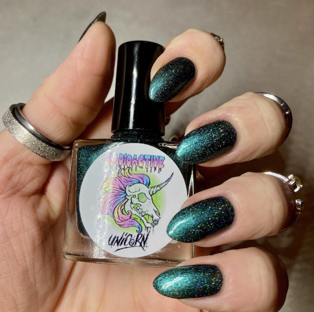 Radioactive Unicorn The Kraken nail polish deep emerald glitter manicure with sparkling ocean inspired finish