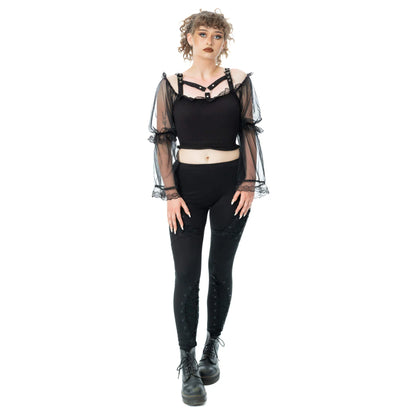 Model wearing Poizen Industries Shadowfang Top Black with a gothic style, paired with black leggings and ankle boots.