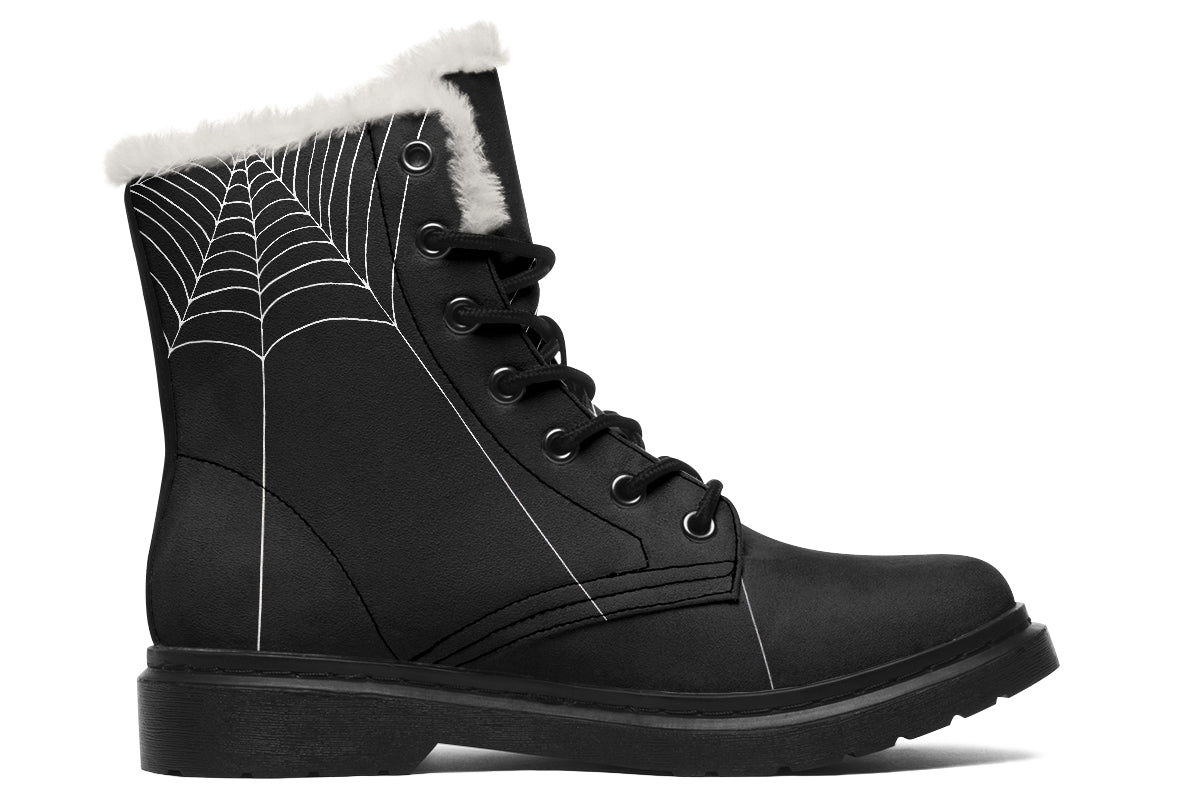Black boot with spider web design and white fur lining on a white background