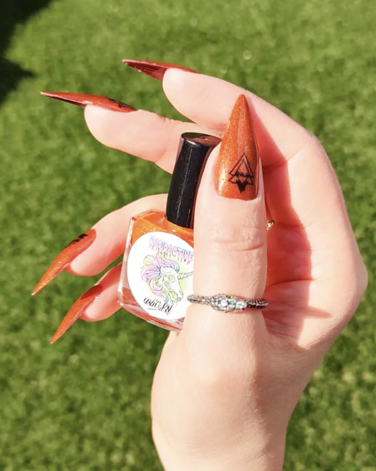 Hallow-Queen striking pumpkin orange nail polish by Radioactive Unicorn
