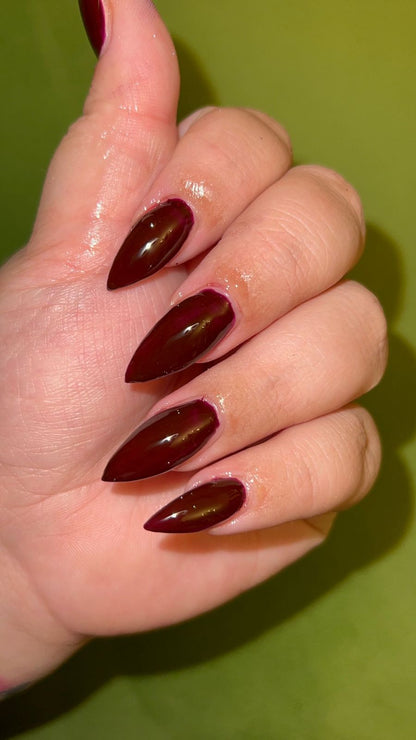Radioactive Unicorn Demobats nail polish swatch deep burgundy glossy manicure with dramatic shine
