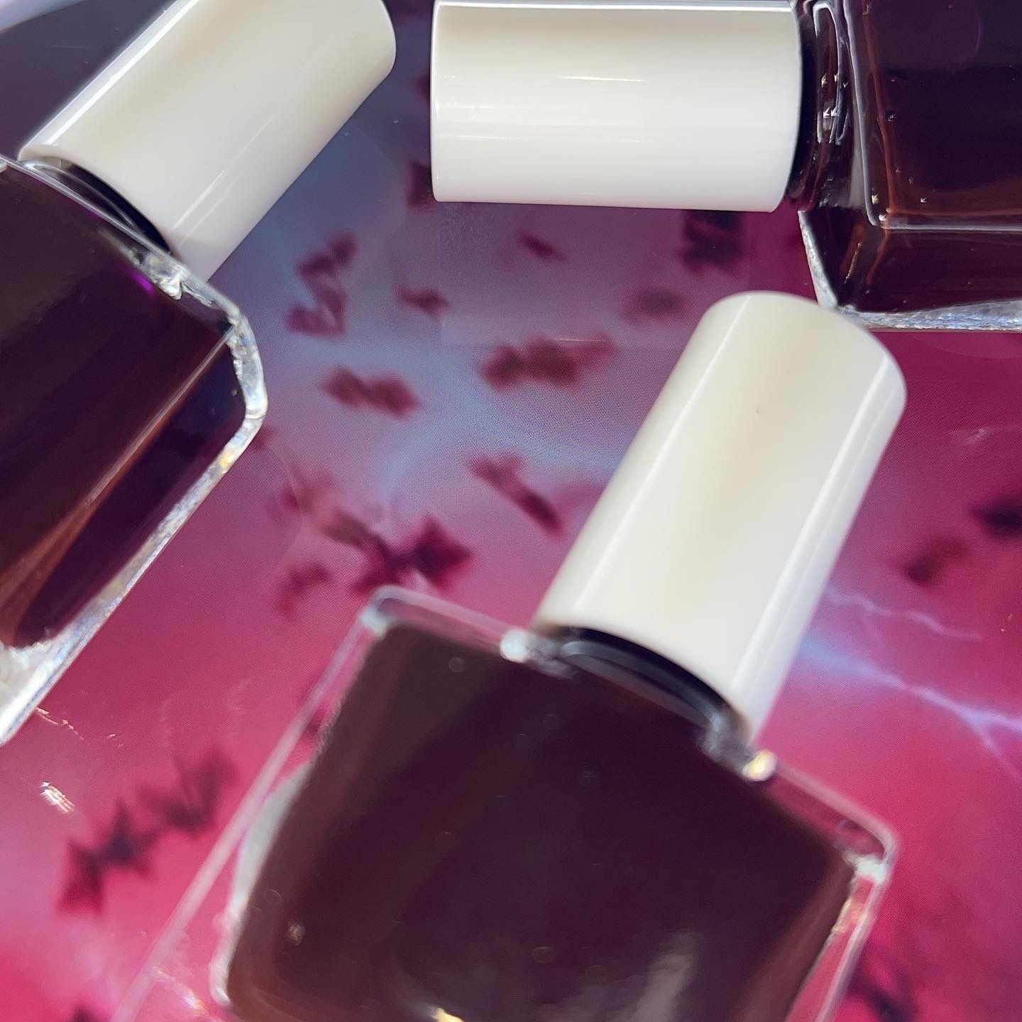 Radioactive Unicorn Demobats burgundy nail polish bottle close-up with rich dark red glossy colour